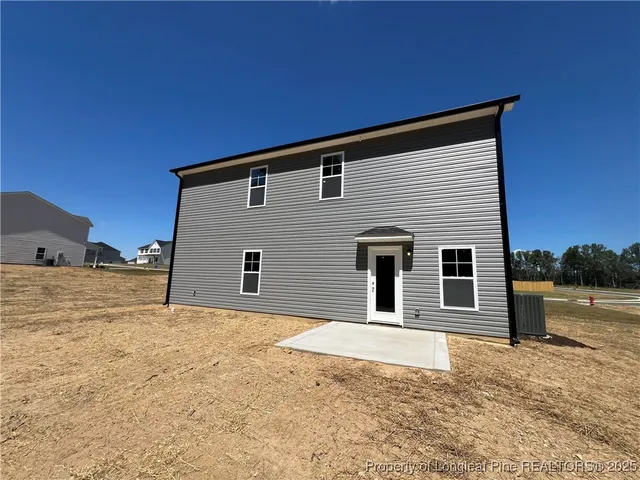 a house with trees in the background