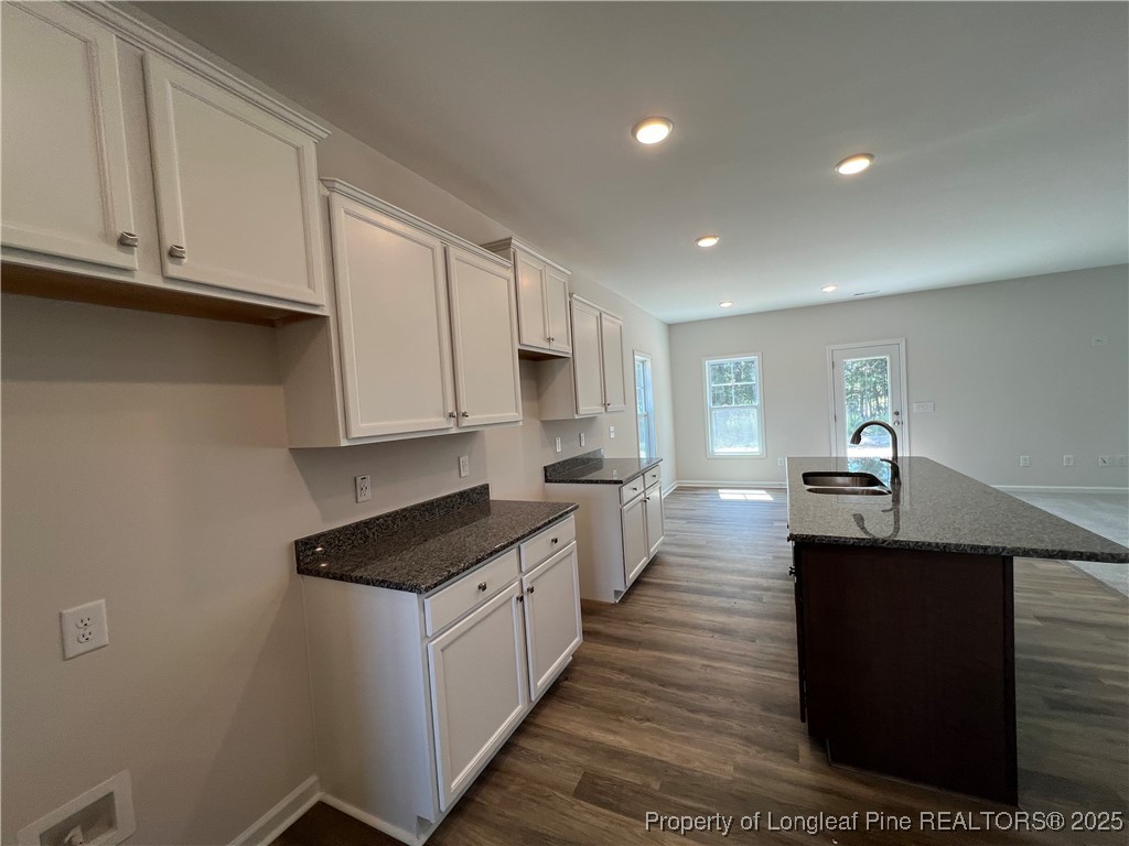 528 Traveller Way Raeford, NC 28376 - Photo 3 of 23 a large kitchen with stainless steel appliances granite countertop a stove a sink and a refrigerator