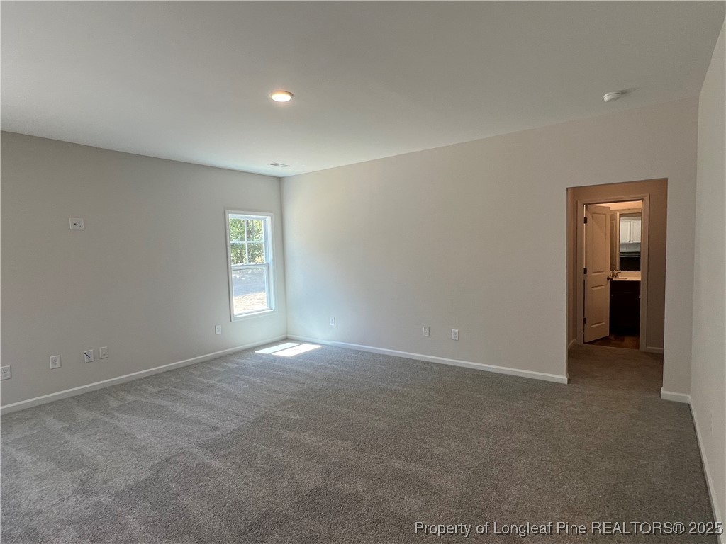 528 Traveller Way Raeford, NC 28376 - Photo 8 of 23 an empty room with windows and closet