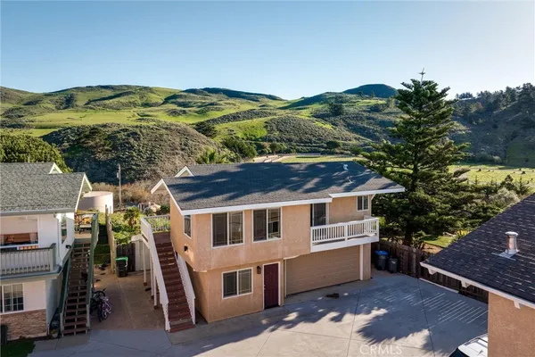 a view of a house with a mountain