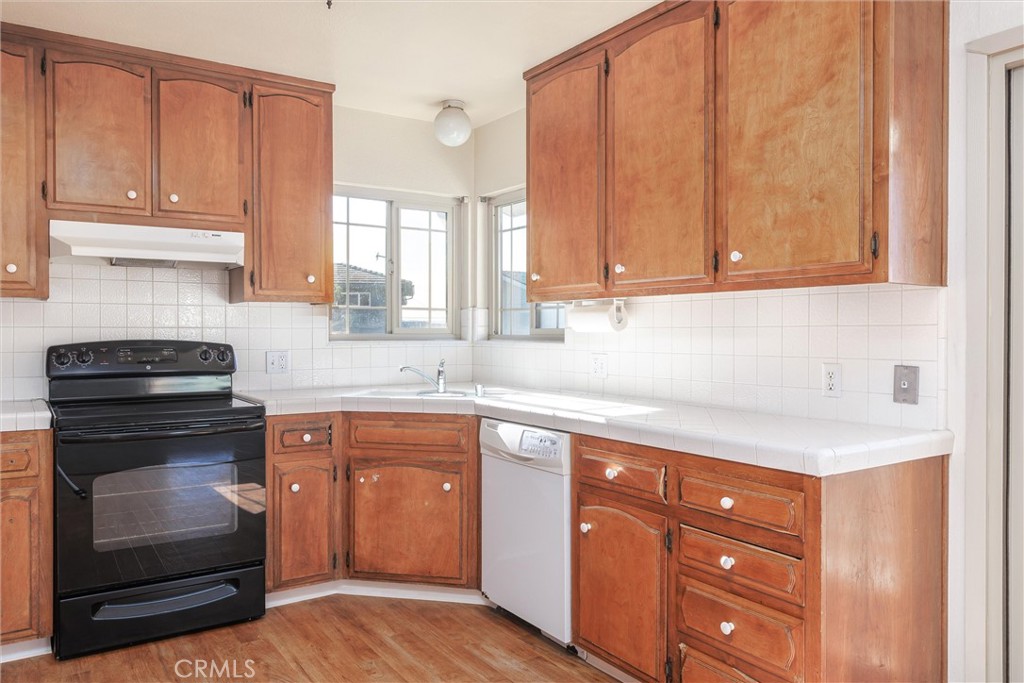 2023 Circle Cayucos, CA 93430 - Photo 23 of 44 a kitchen with granite countertop cabinets stainless steel appliances and a sink