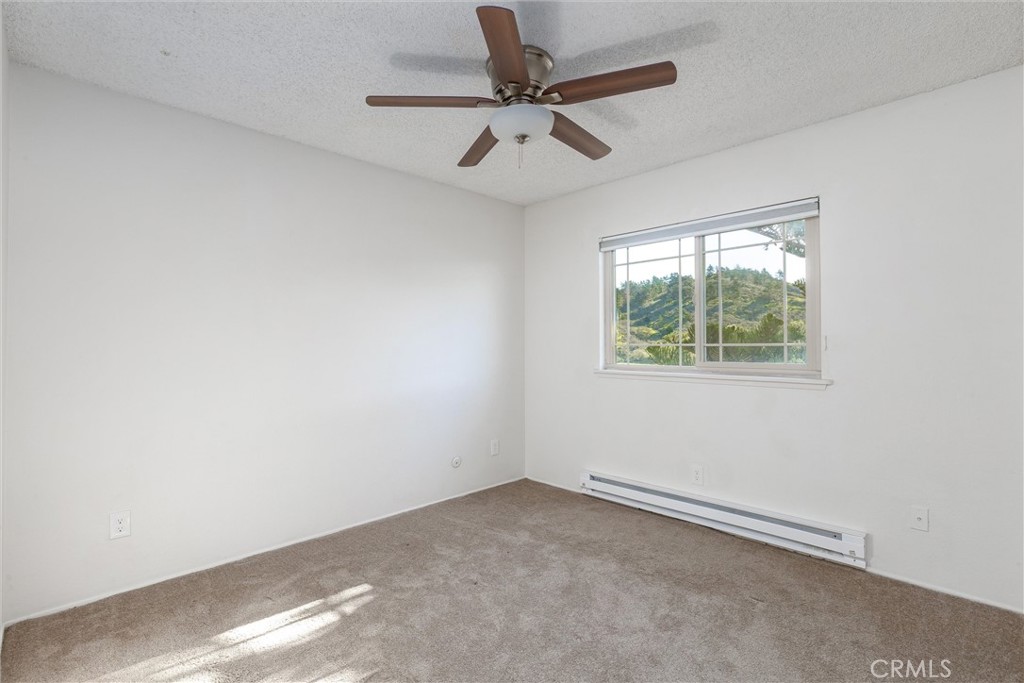 2023 Circle Cayucos, CA 93430 - Photo 25 of 44 an empty room with a window and a fan
