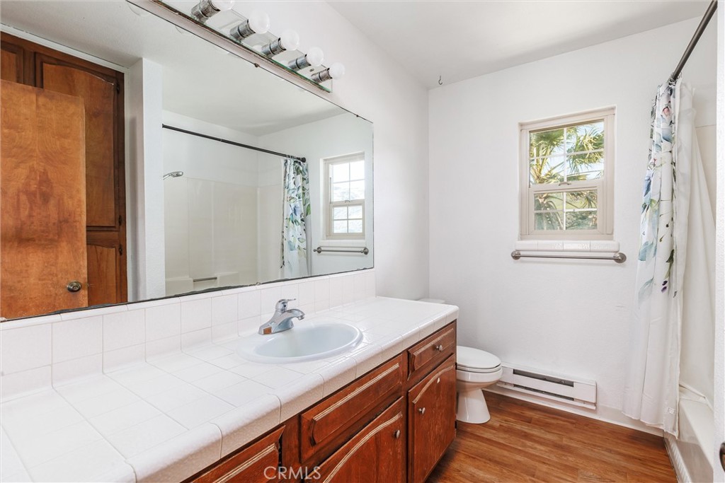 2023 Circle Cayucos, CA 93430 - Photo 26 of 44 a bathroom with a sink a toilet and a window