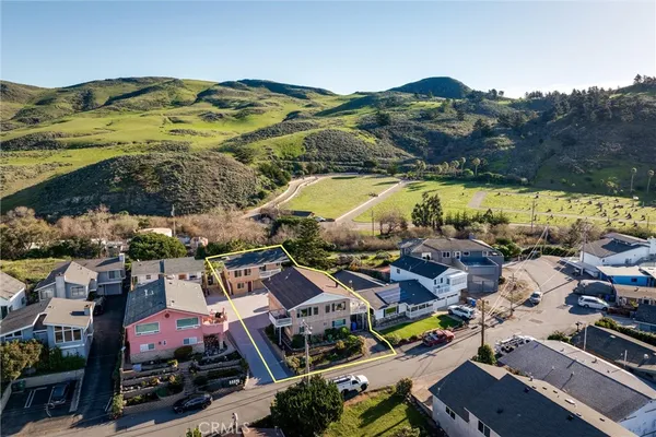 an aerial view of residential houses with outdoor space