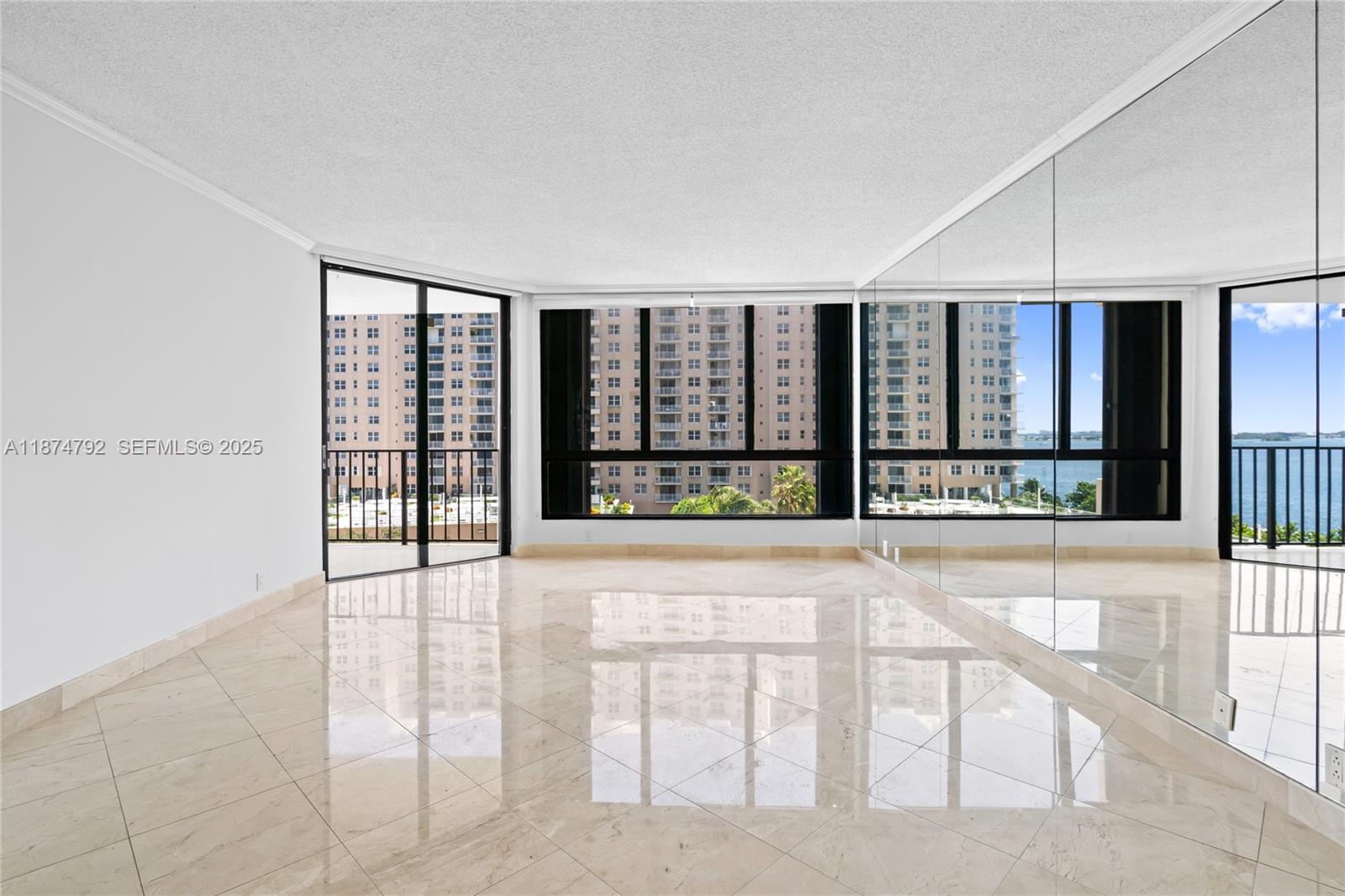 520 Brickell Key Drive, Unit A705 Miami, FL 33131 - Photo 20 of 63 a view of an entryway with a floor to ceiling window