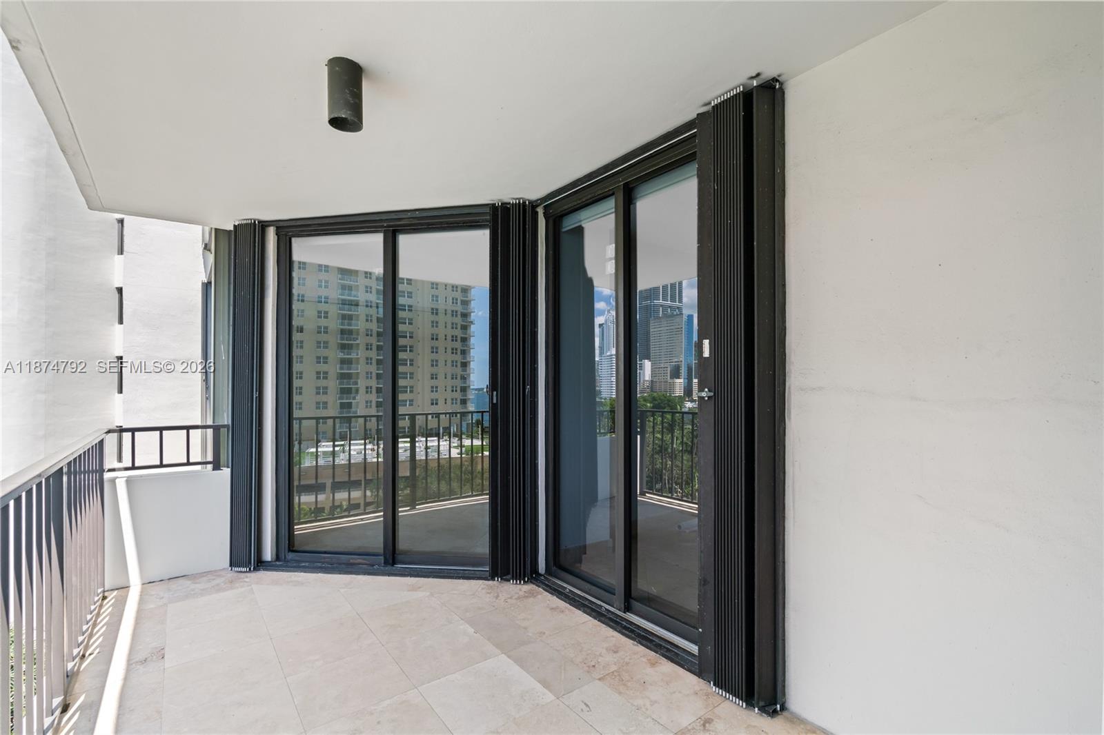 520 Brickell Key Drive, Unit A705 Miami, FL 33131 - Photo 27 of 63 a view of a big room with windows and balcony