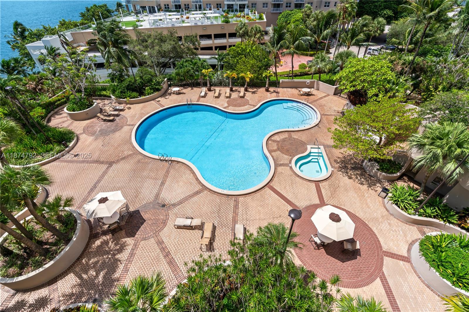 520 Brickell Key Drive, Unit A705 Miami, FL 33131 - Photo 53 of 63 an aerial view of a swimming pool and outdoor space