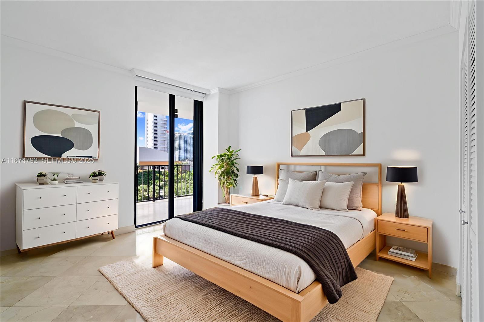 520 Brickell Key Drive, Unit A705 Miami, FL 33131 - Photo 6 of 63 a bedroom with a bed and a dresser