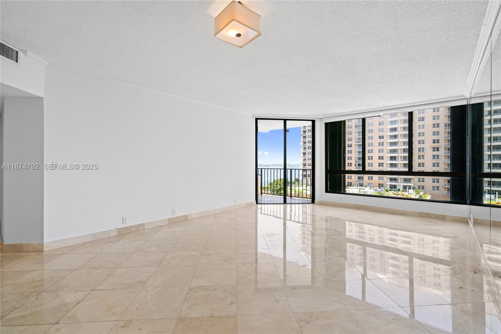 520 Brickell Key Drive, Unit A705 Miami, FL 33131 - Photo 9 of 63 wooden floor in an empty room with a window