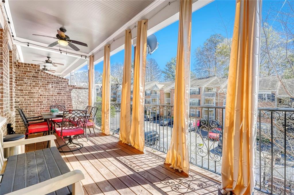 1196 John Collier Road Northwest, Unit 1196 Atlanta, GA 30318 - Photo 11 of 26 a view of living room with furniture and floor to ceiling windows
