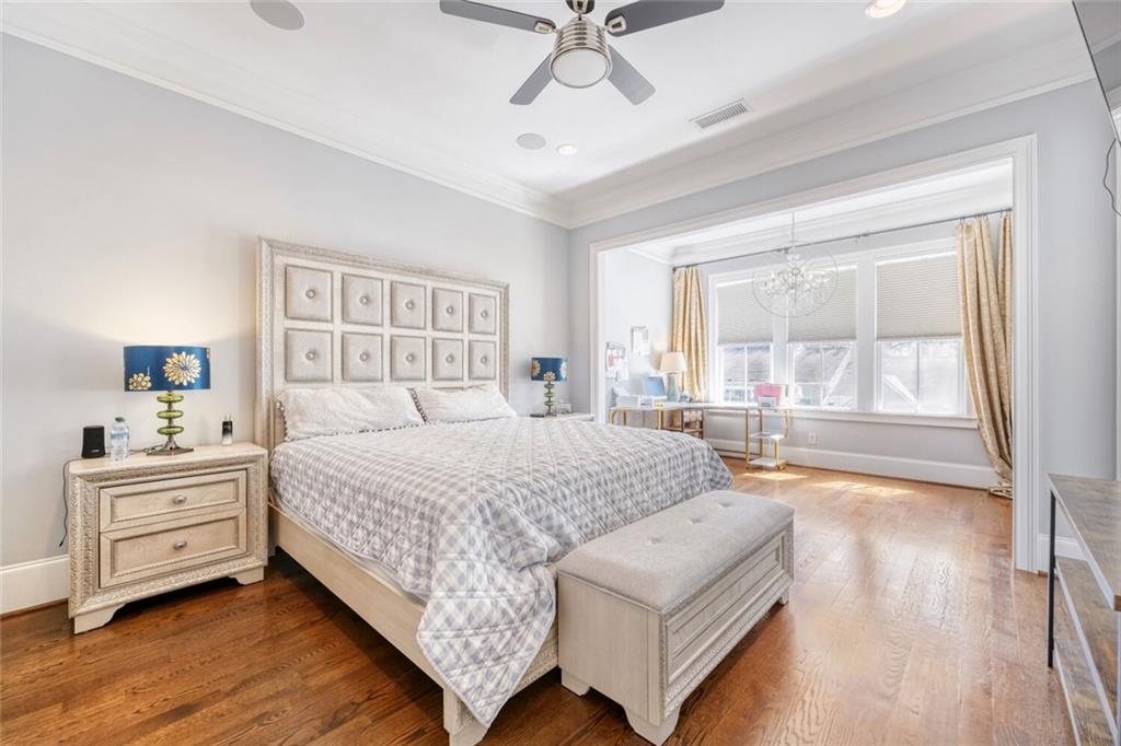 1196 John Collier Road Northwest, Unit 1196 Atlanta, GA 30318 - Photo 12 of 26 a bedroom with a large bed and a large window