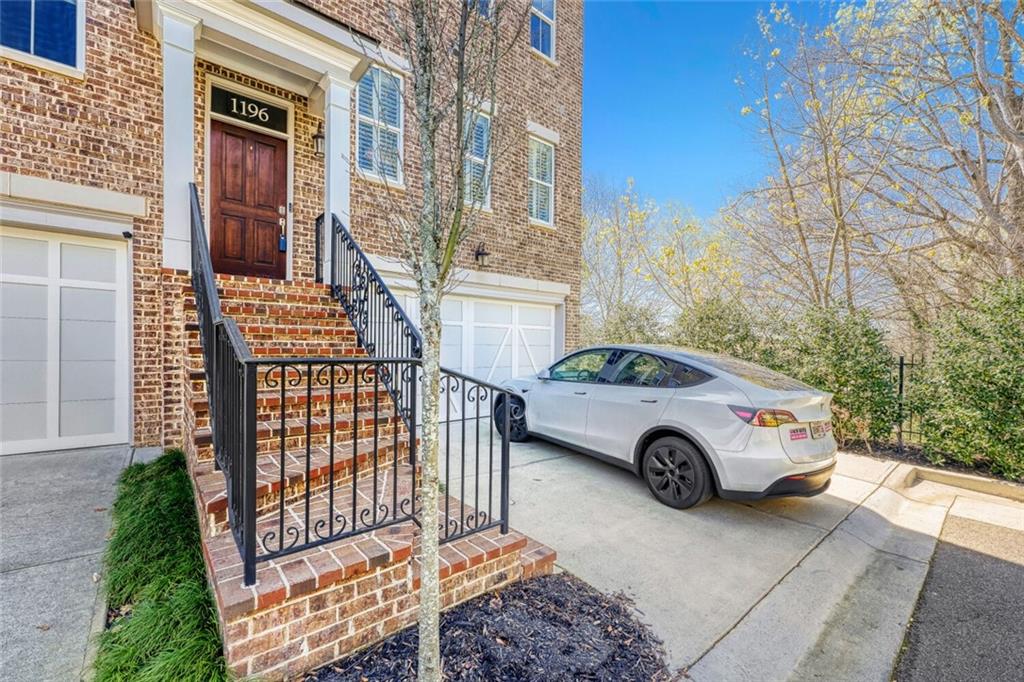 1196 John Collier Road Northwest, Unit 1196 Atlanta, GA 30318 - Photo 2 of 26 a car parked in front of a building