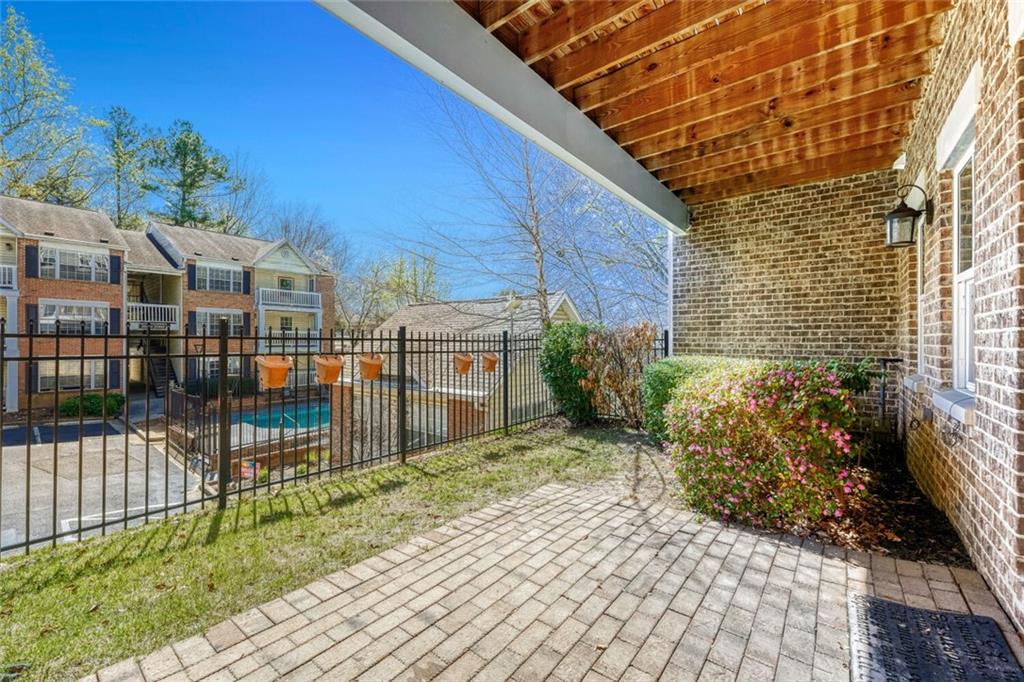 1196 John Collier Road Northwest, Unit 1196 Atlanta, GA 30318 - Photo 25 of 26 a view of a brick house with many windows