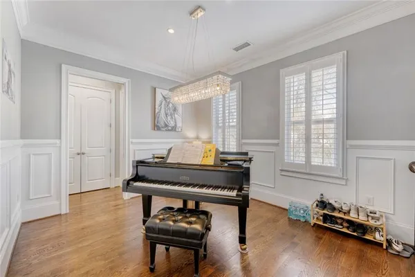 a living room with furniture pool table and a window
