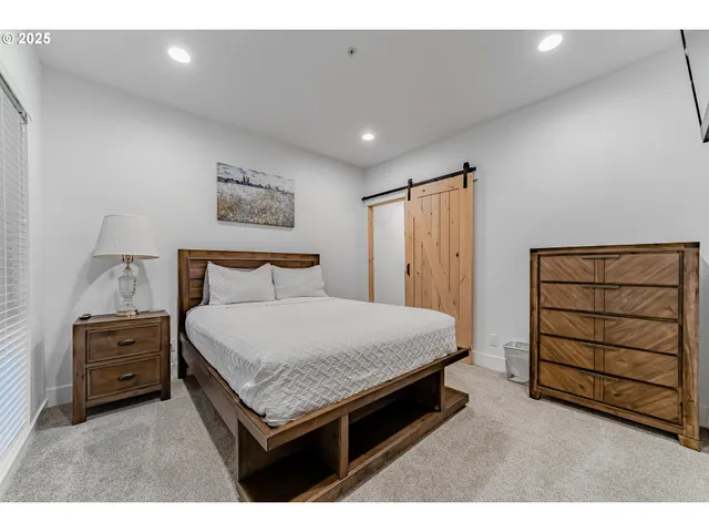 a bedroom with a bed and a dresser