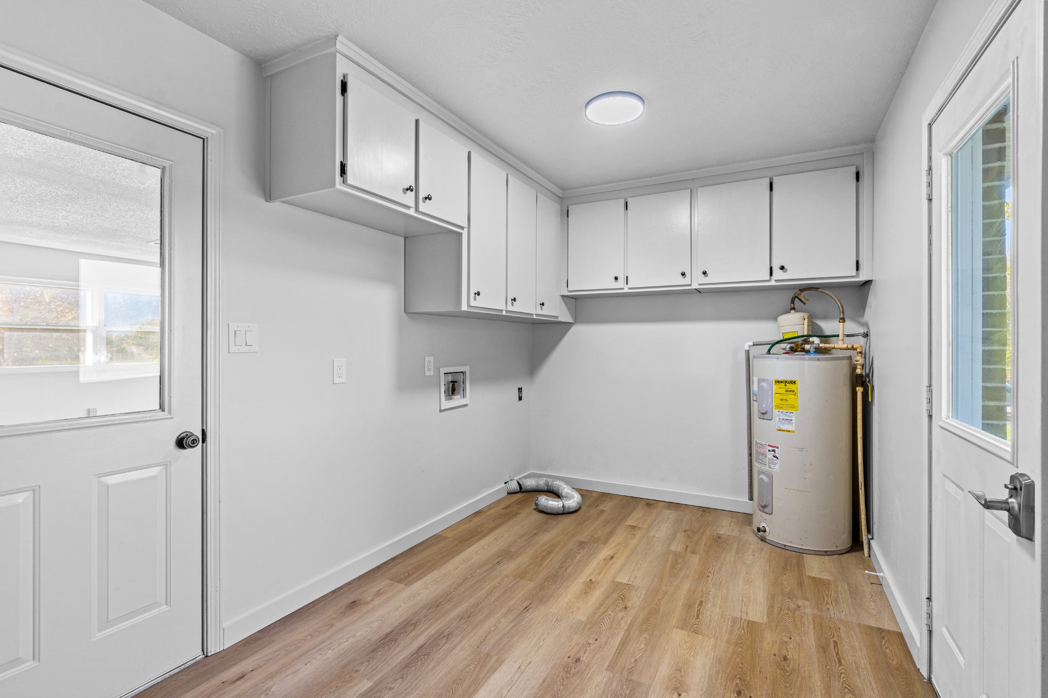 191 Blanton Chapel Road Manchester, TN 37355 - Photo 13 of 26 a view of storage and utility room with stainless steel appliances wooden floor