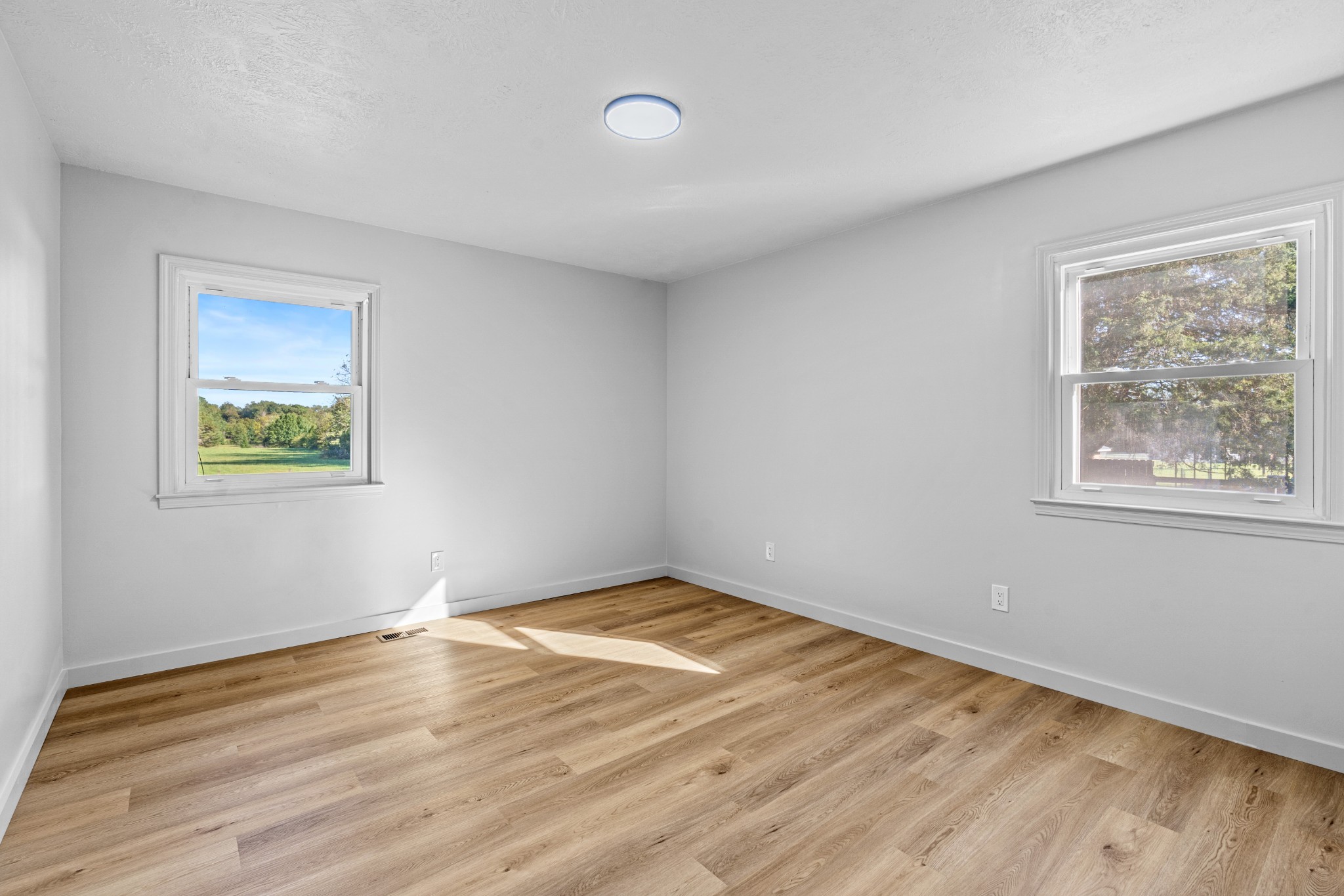191 Blanton Chapel Road Manchester, TN 37355 - Photo 17 of 26 a view of empty room with wooden floor and fan