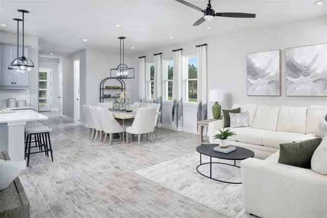 a large kitchen with a table and chairs