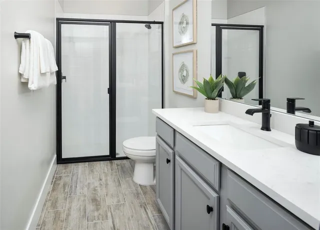 a utility room with cabinets washer and dryer