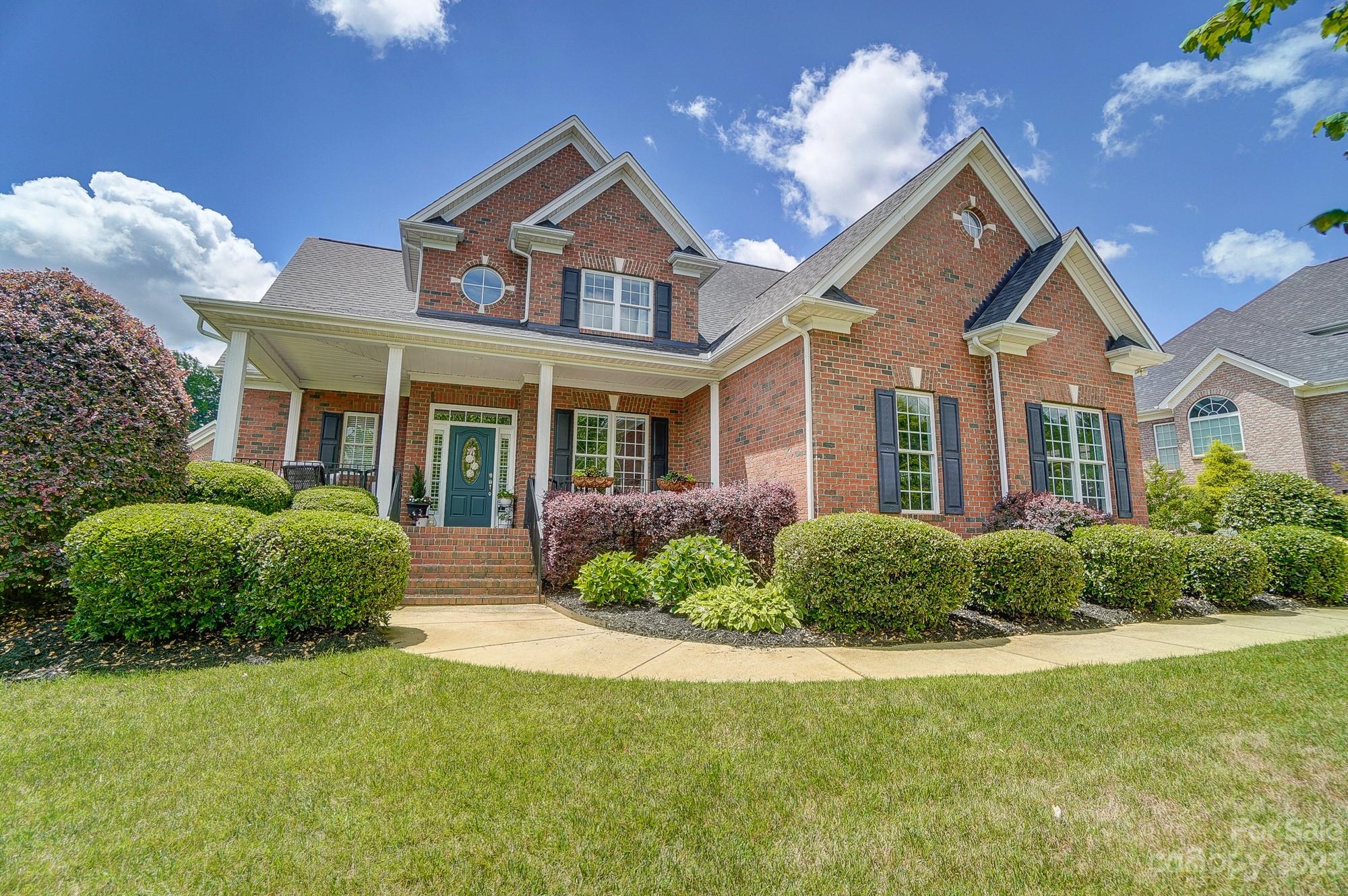 1105 Legacy Lane Fort Mill, SC 29708 - Photo 2 of 43 a front view of a house with a yard