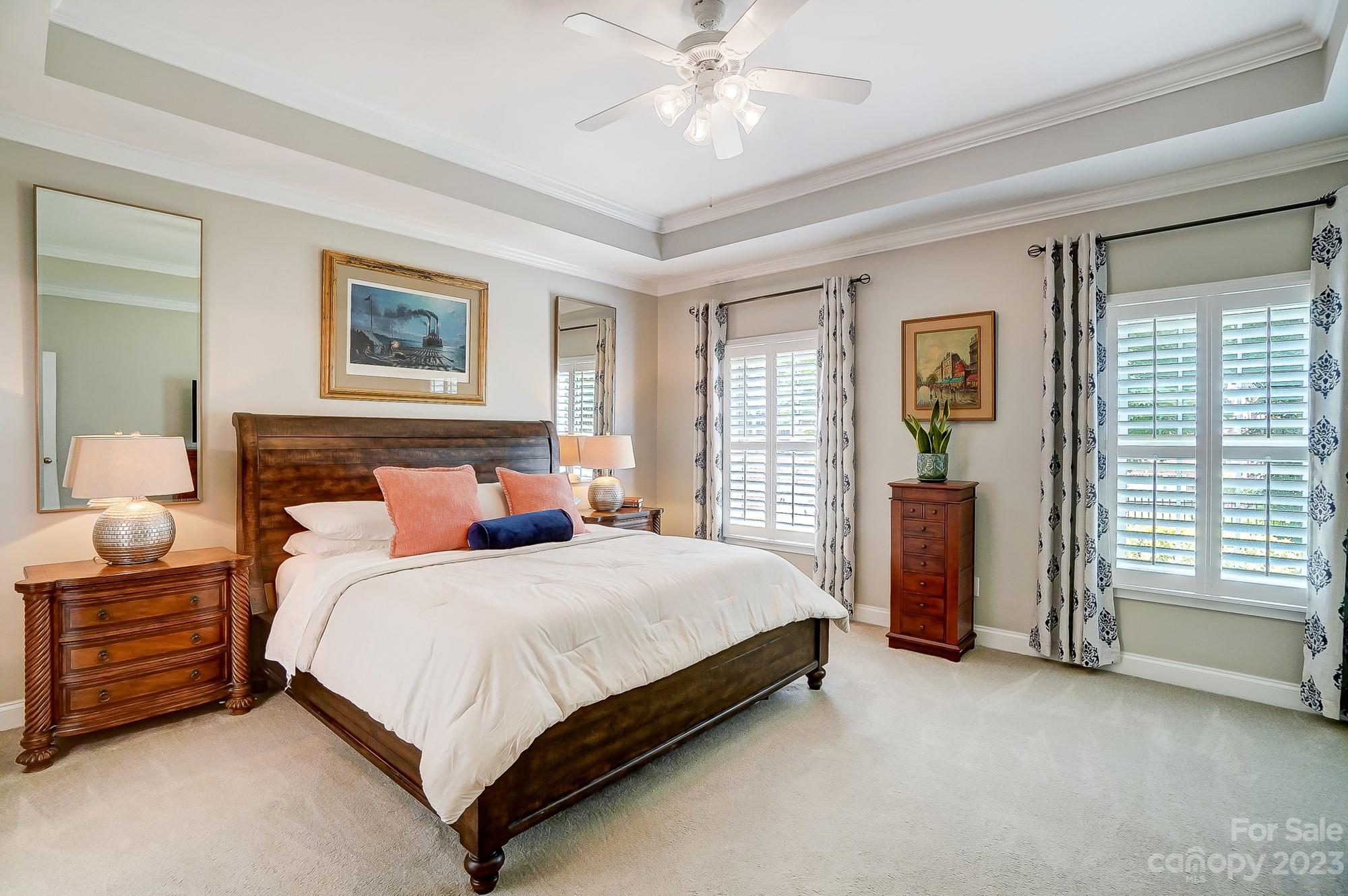 1105 Legacy Lane Fort Mill, SC 29708 - Photo 21 of 43 a bedroom with a bed and a chandelier
