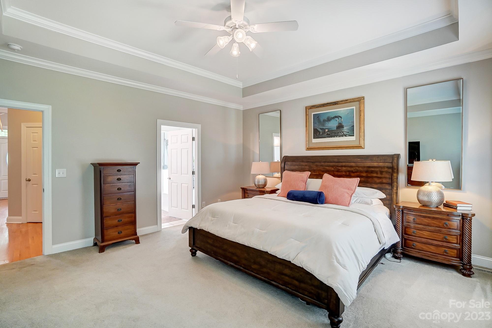 1105 Legacy Lane Fort Mill, SC 29708 - Photo 22 of 43 a bedroom with a bed and a chandelier