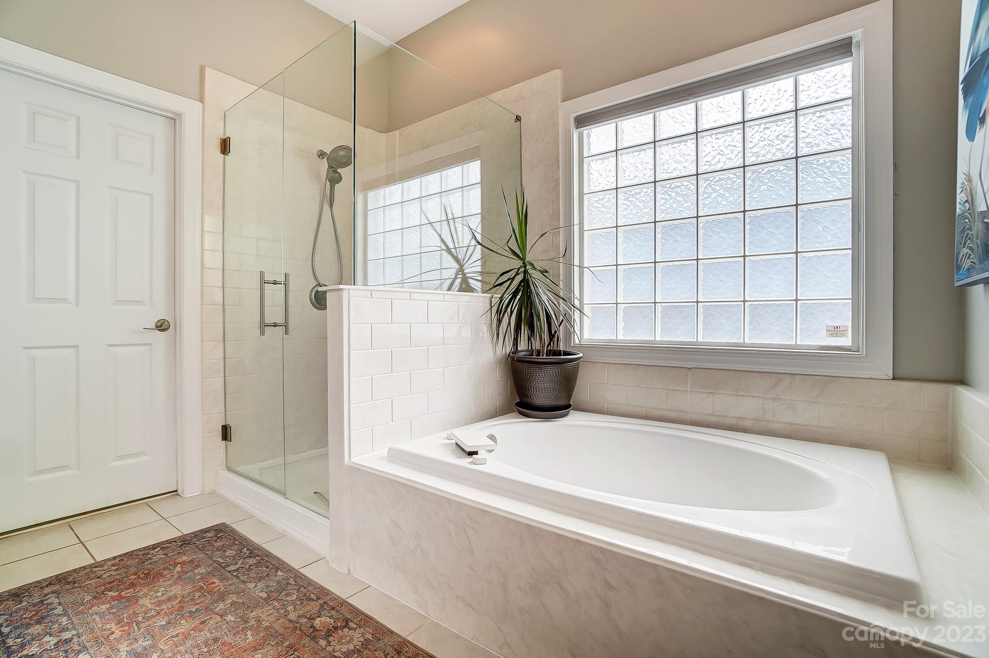 1105 Legacy Lane Fort Mill, SC 29708 - Photo 24 of 43 a bathroom with a tub and a shower