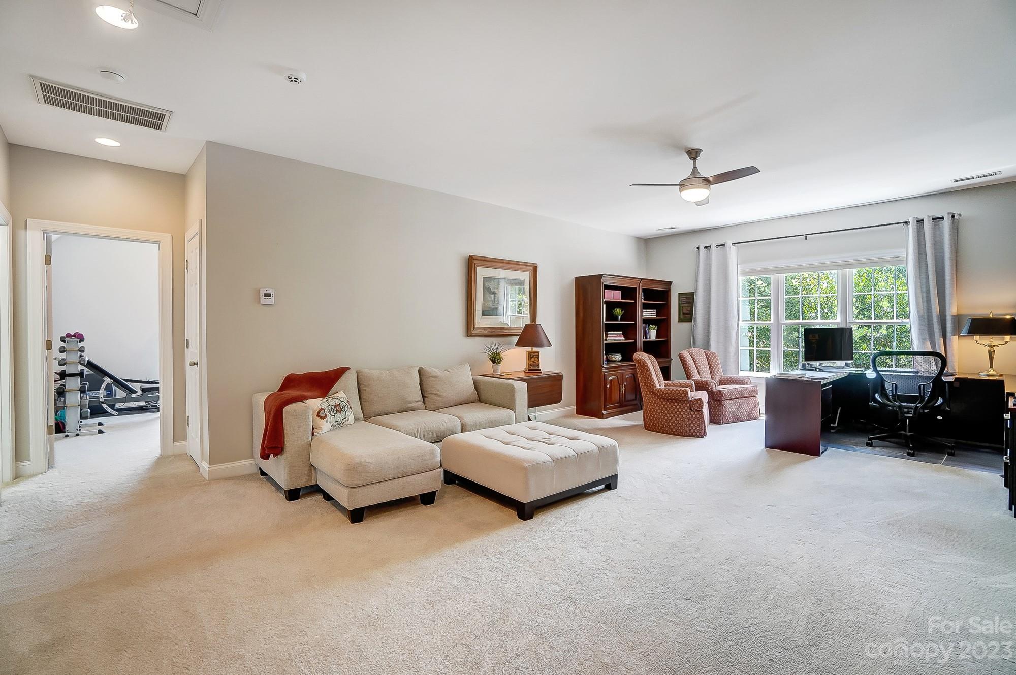 1105 Legacy Lane Fort Mill, SC 29708 - Photo 25 of 43 a living room with furniture and a large window