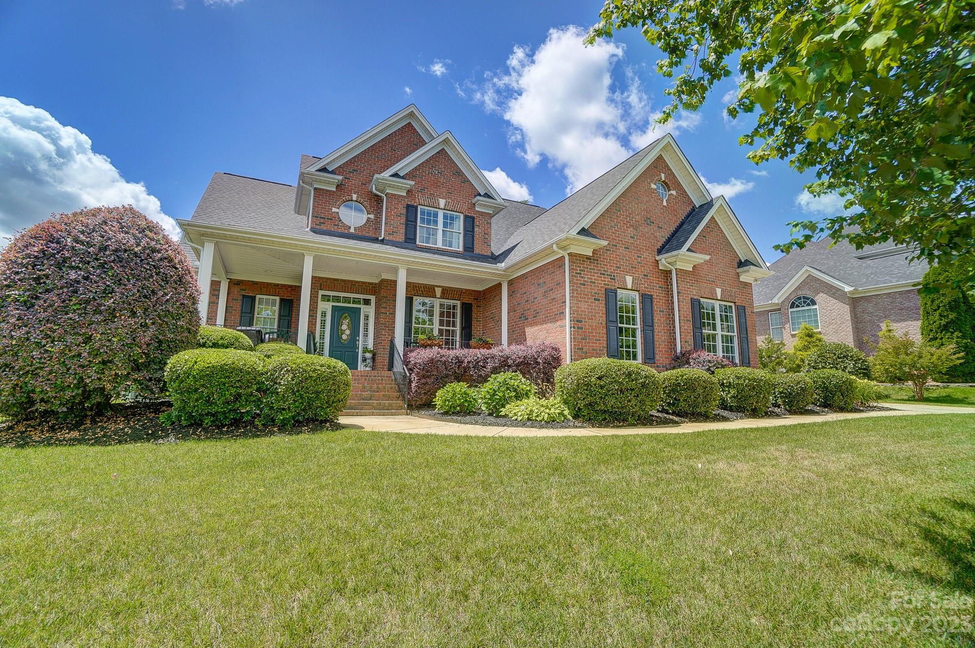 1105 Legacy Lane Fort Mill, SC 29708 - Photo 3 of 43 a front view of a house with a yard