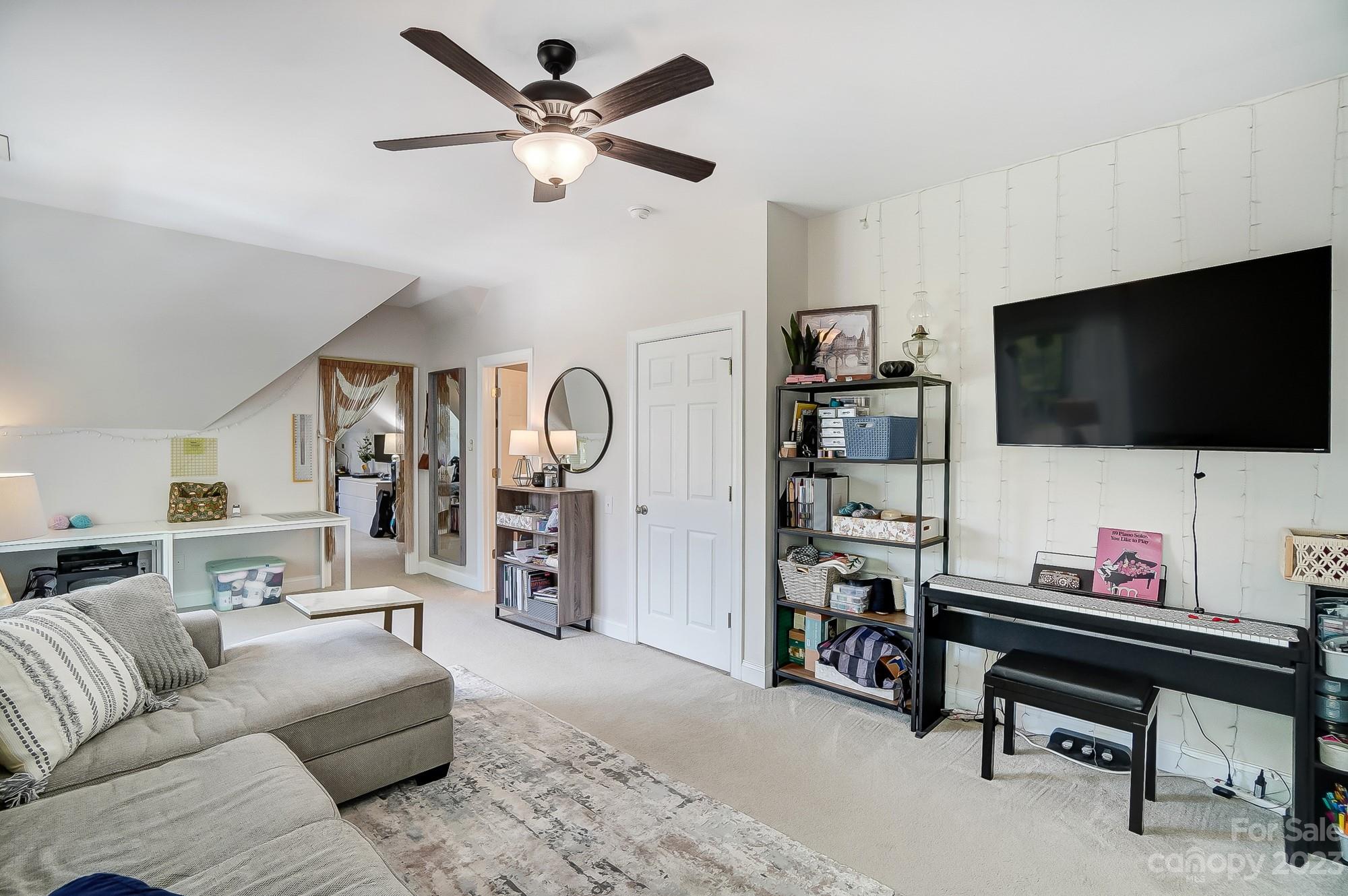 1105 Legacy Lane Fort Mill, SC 29708 - Photo 34 of 43 a living room with furniture and a flat screen tv