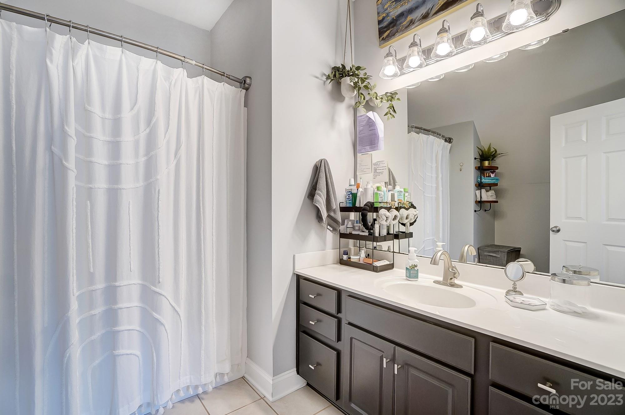 1105 Legacy Lane Fort Mill, SC 29708 - Photo 36 of 43 a bathroom with a double vanity sink and a mirror