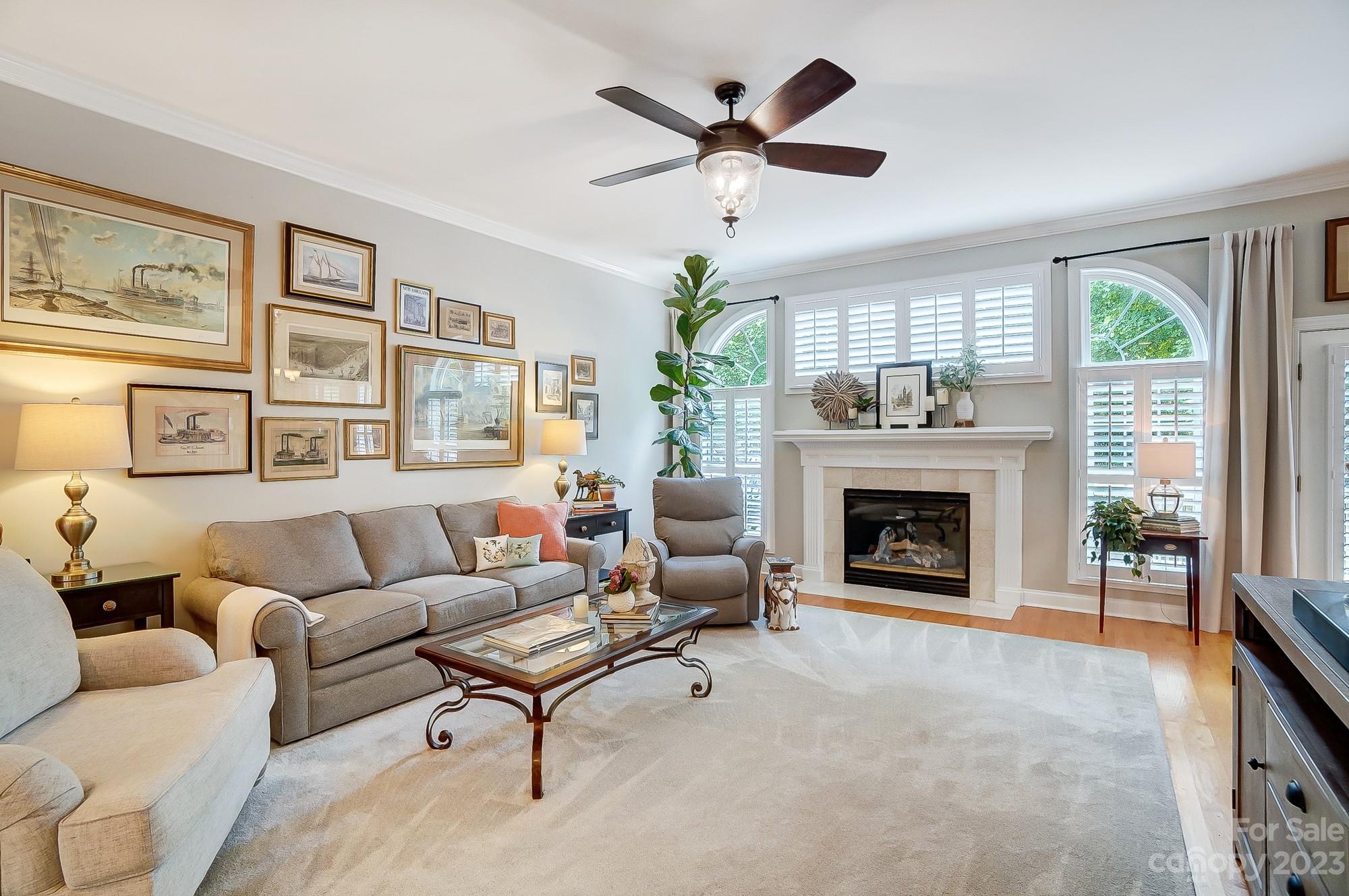 1105 Legacy Lane Fort Mill, SC 29708 - Photo 7 of 43 a living room with furniture a window and a fireplace