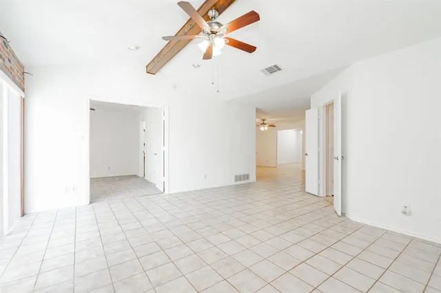 a view of an empty room and window