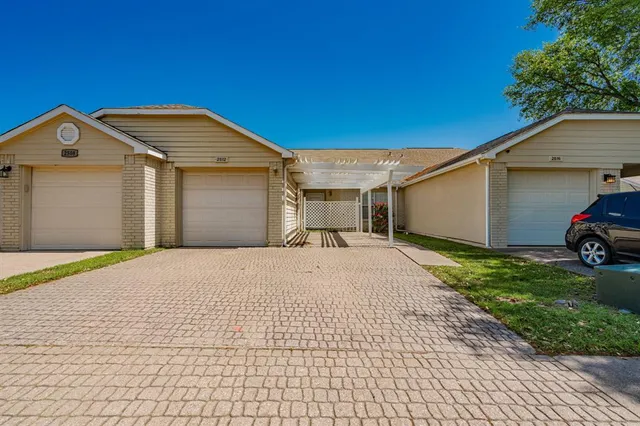 a view of garage and yard