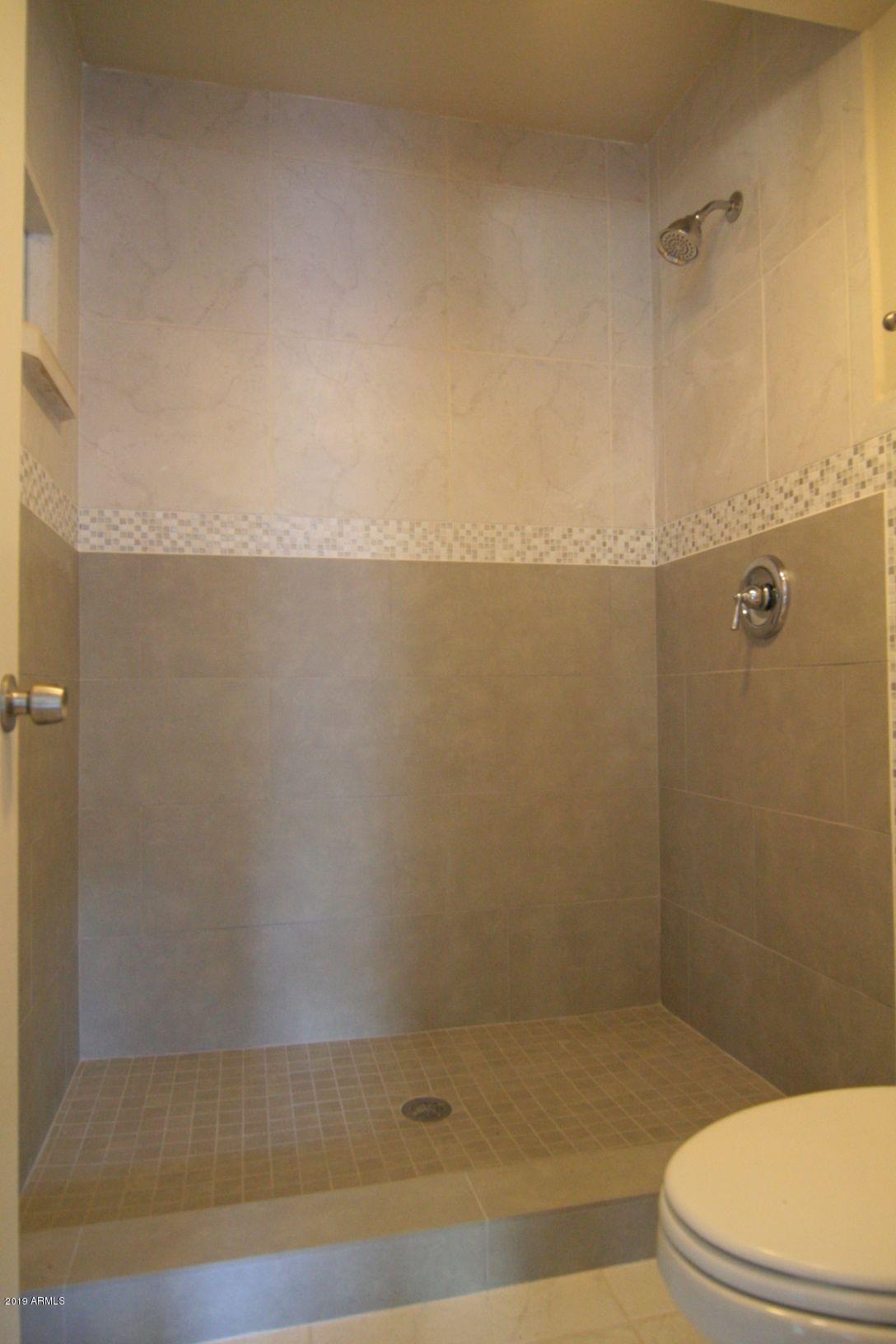 136 West Victoria Square Phoenix, AZ 85013 - Photo 8 of 15 a bathroom with a shower and a toilet