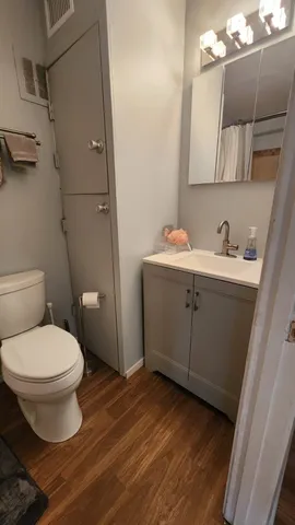 a bathroom with a toilet and a shower