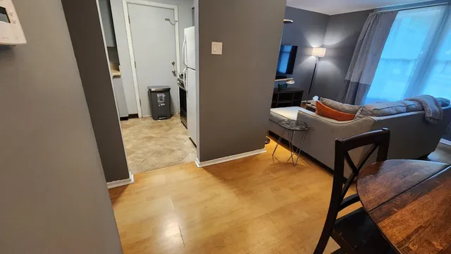 a room with furniture and lamp