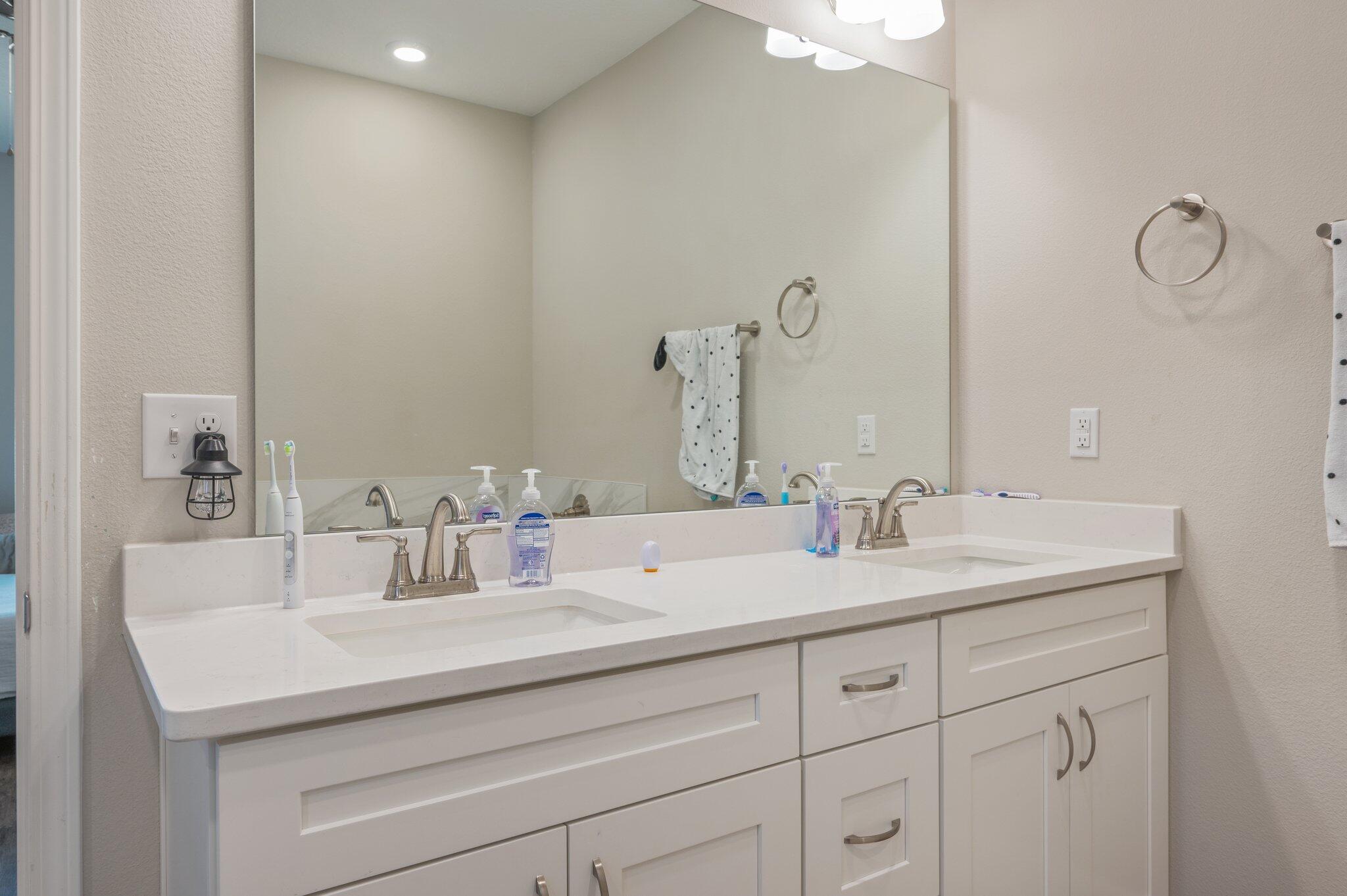 5179 Rabbit Run Crestview, FL 32539 - Photo 14 of 30 a bathroom with a sink and a mirror