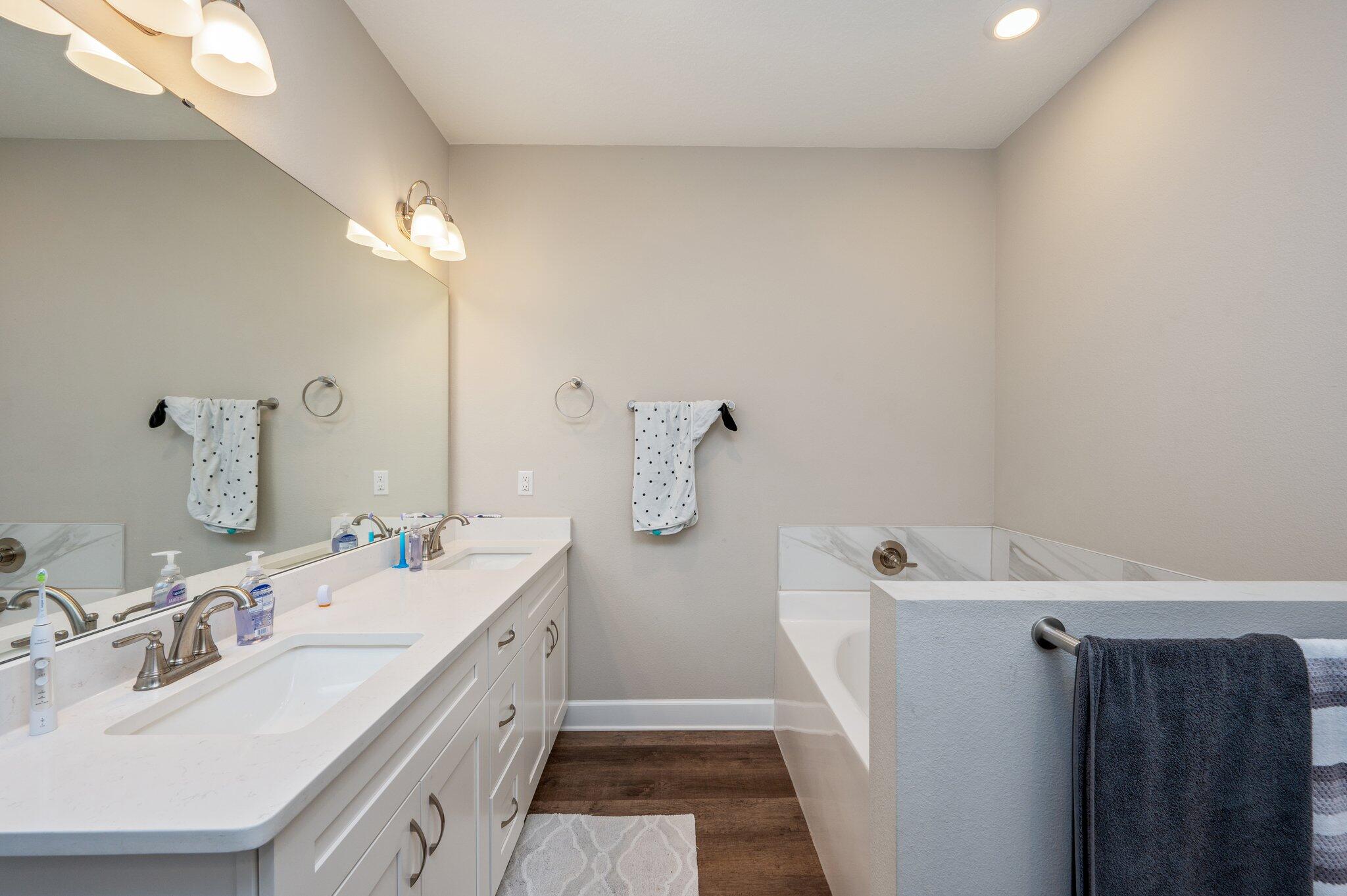 5179 Rabbit Run Crestview, FL 32539 - Photo 15 of 30 a bathroom with a double vanity sink and mirror