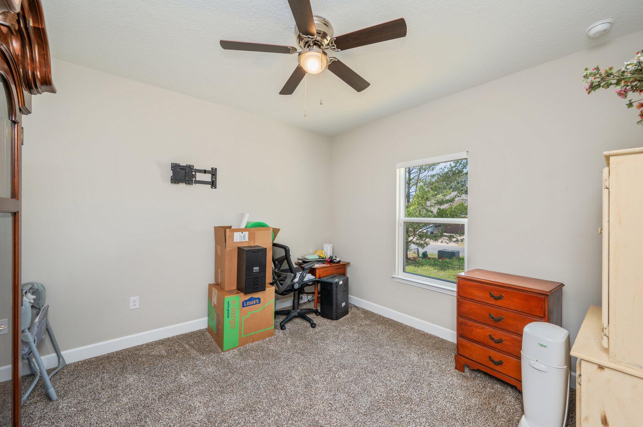 5179 Rabbit Run Crestview, FL 32539 - Photo 20 of 30 a room with furniture and a window