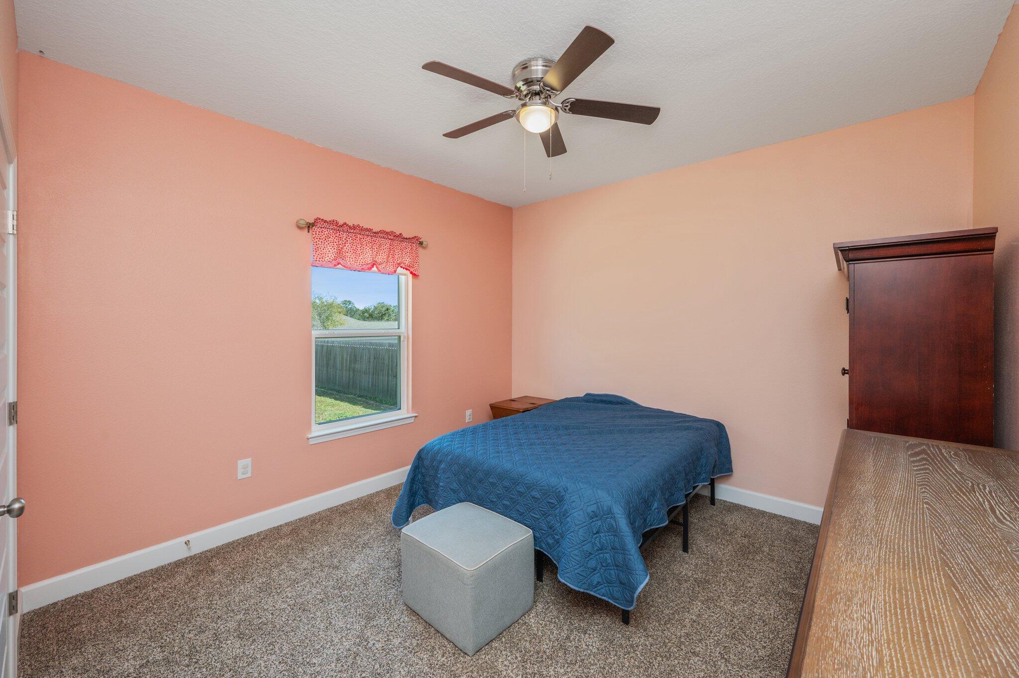 5179 Rabbit Run Crestview, FL 32539 - Photo 23 of 30 a room with a bed and a window