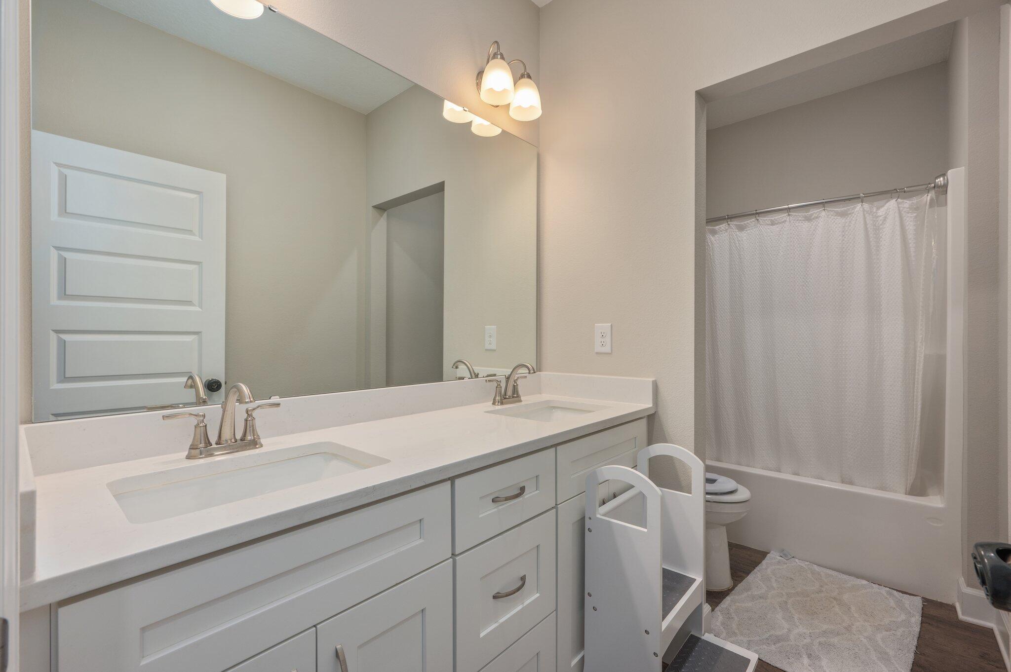 5179 Rabbit Run Crestview, FL 32539 - Photo 24 of 30 a bathroom with a sink and a mirror