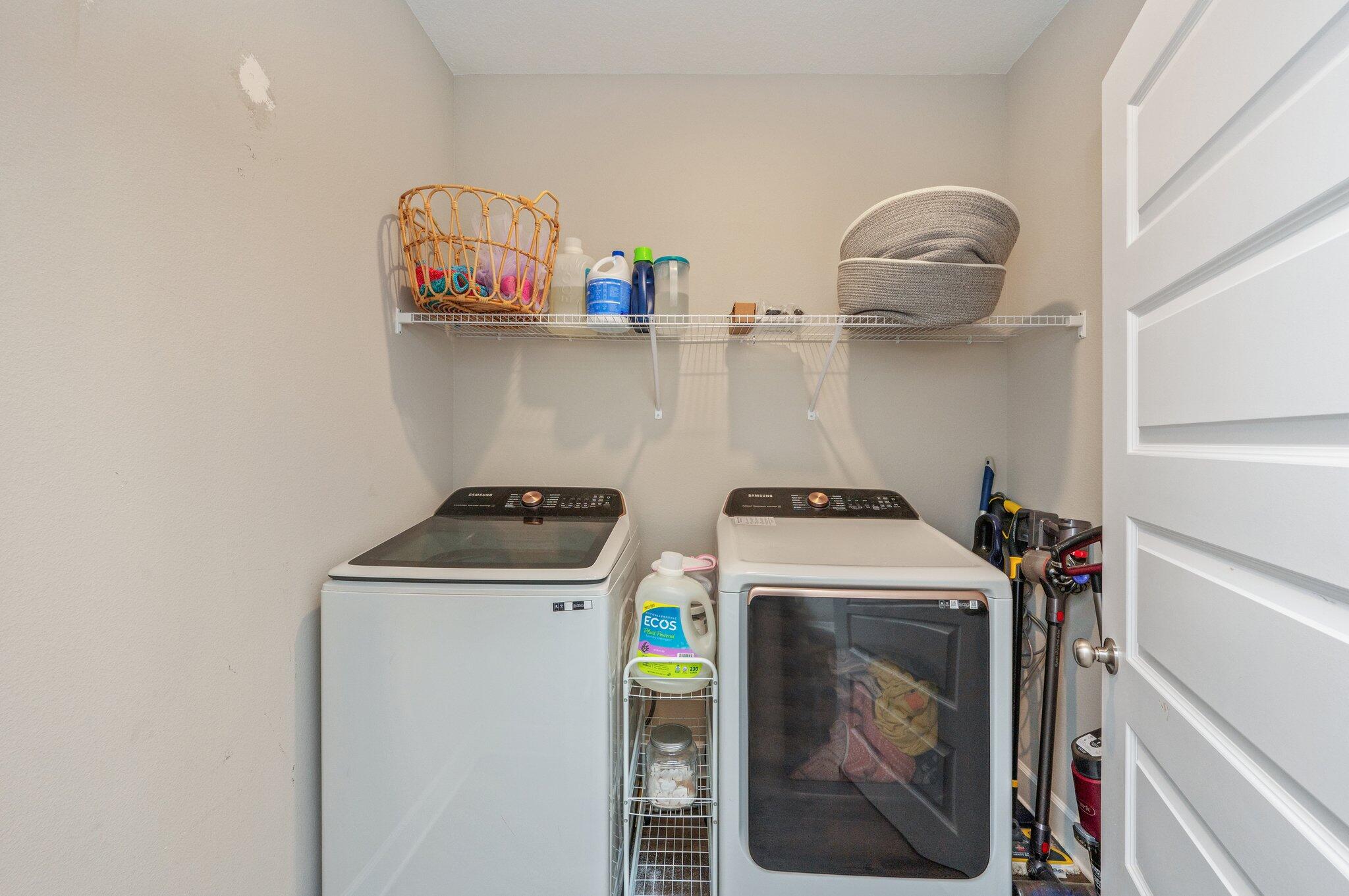 5179 Rabbit Run Crestview, FL 32539 - Photo 27 of 30 a utility room with dryer washer and a view of kitchen