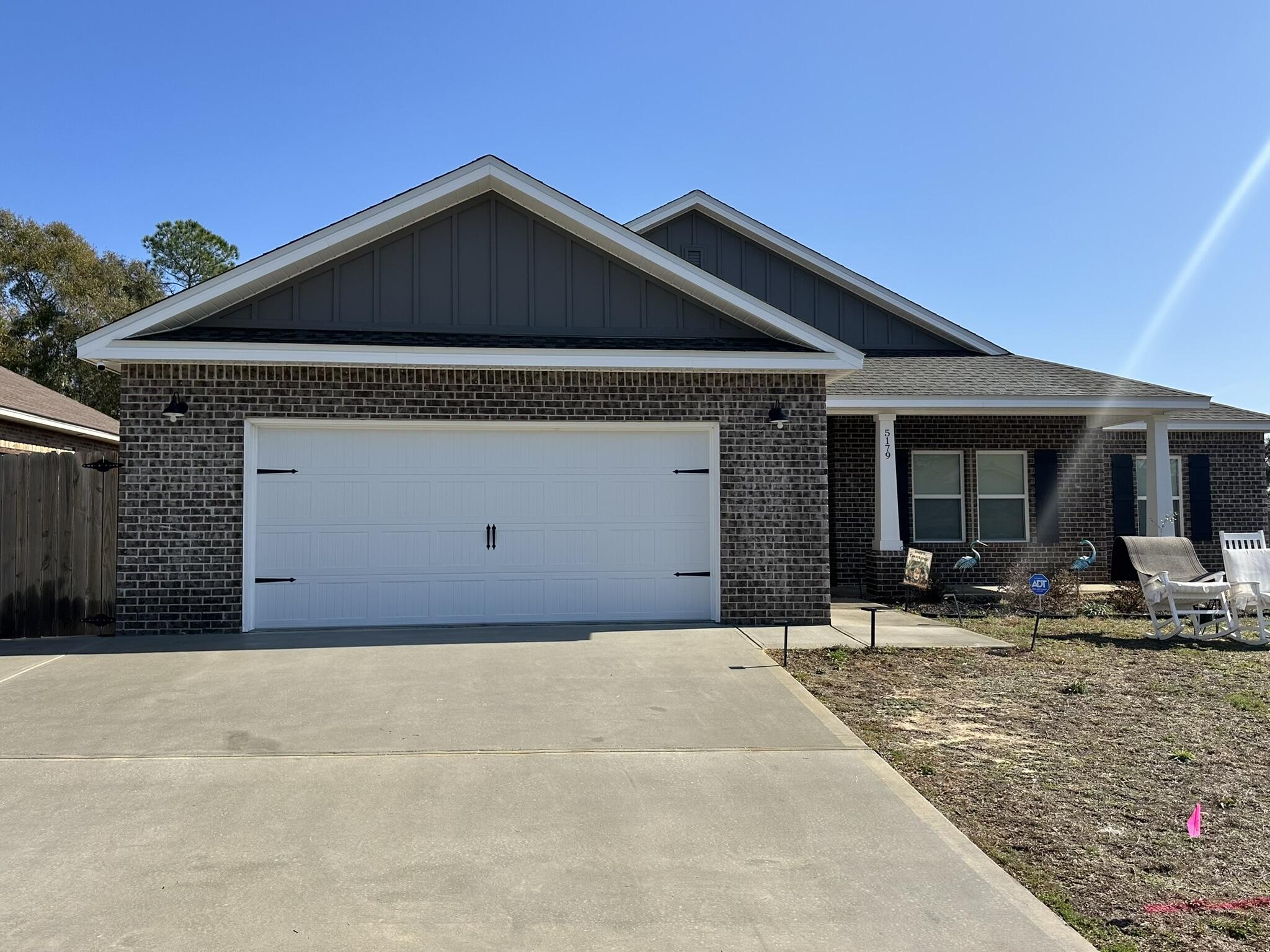 5179 Rabbit Run Crestview, FL 32539 - Photo 28 of 30 a front view of a house with yard and garage