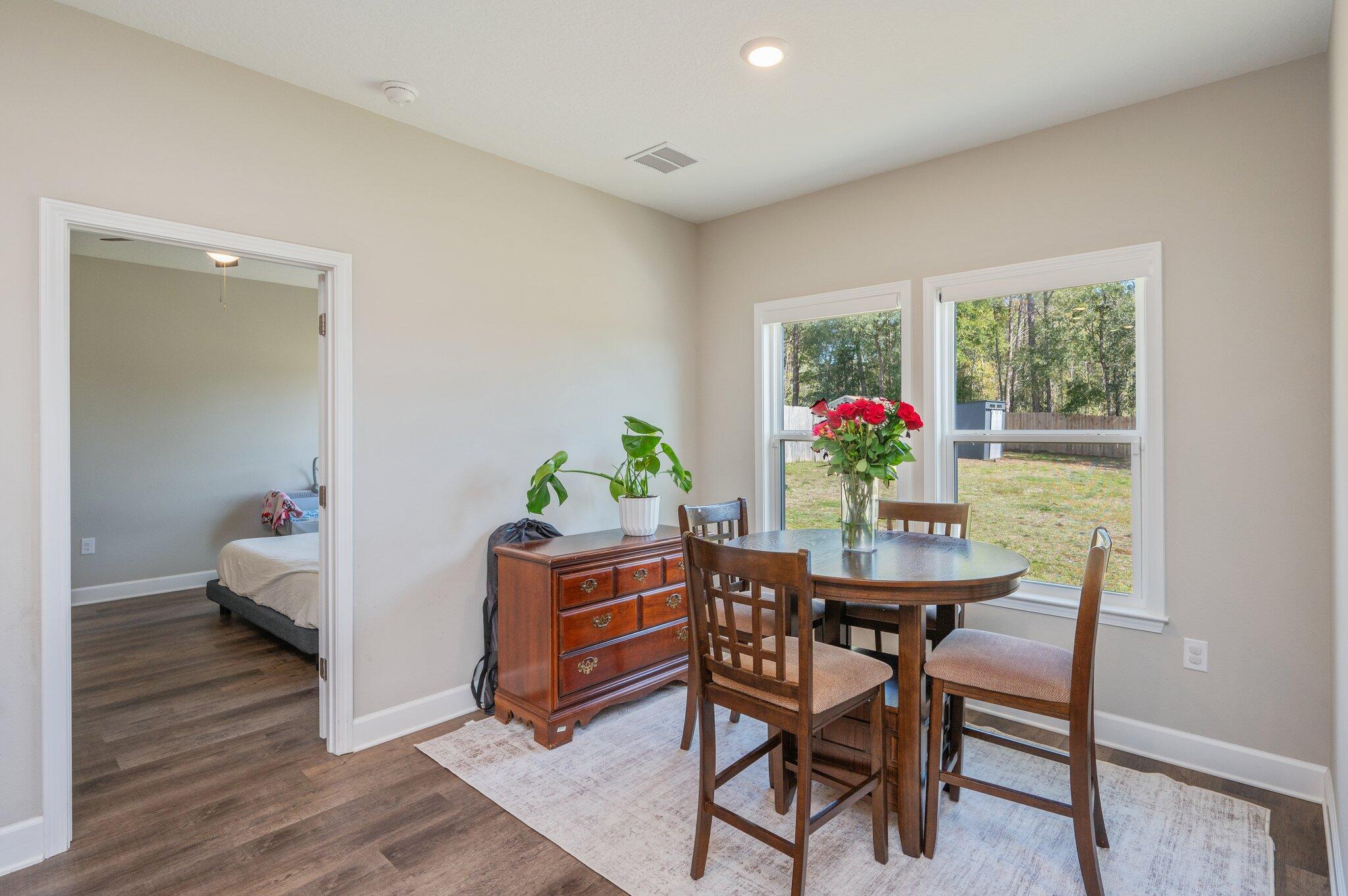 5179 Rabbit Run Crestview, FL 32539 - Photo 6 of 30 a view of a dining room with furniture window and wooden floor