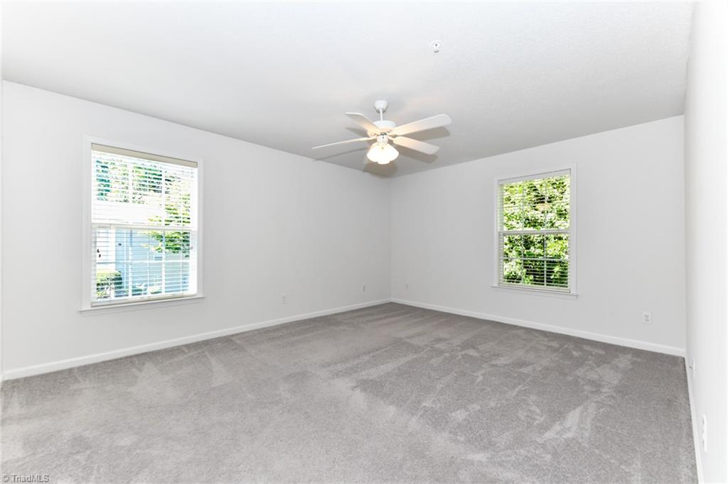 623 Timberline Ridge Lane Winston-Salem, NC 27106 - Photo 14 of 25 Bright primary bedroom with walk in closet