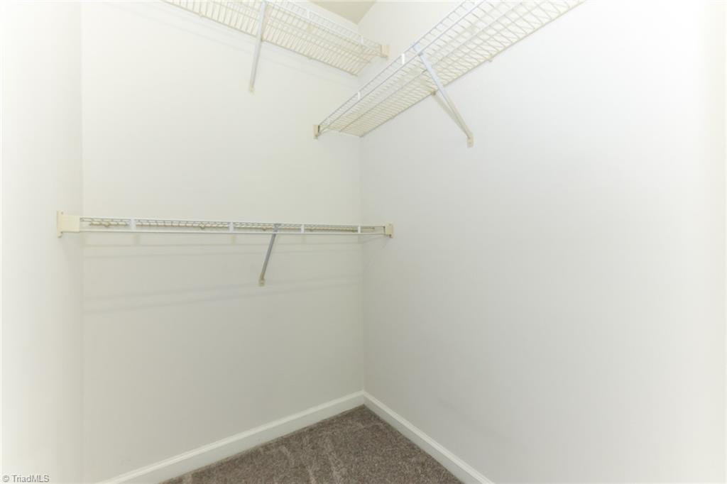 623 Timberline Ridge Lane Winston-Salem, NC 27106 - Photo 21 of 25 Primary bedroom walk-in closet