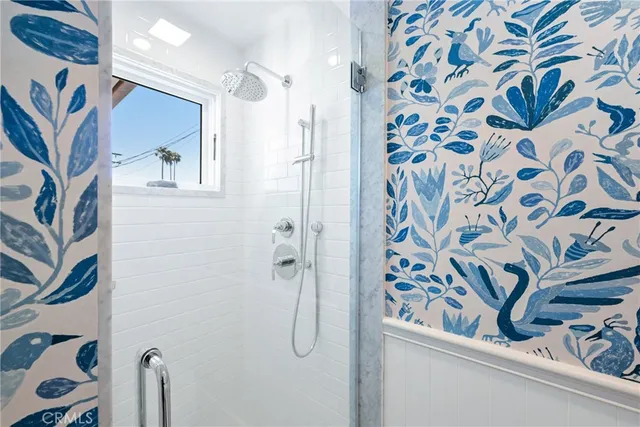 a living room with furniture a chandelier and a window