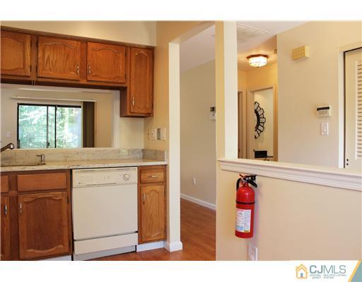 2001 Timber Oaks Road Edison, NJ 08820 - Photo 14 of 25 a kitchen with a refrigerator sink and cabinets
