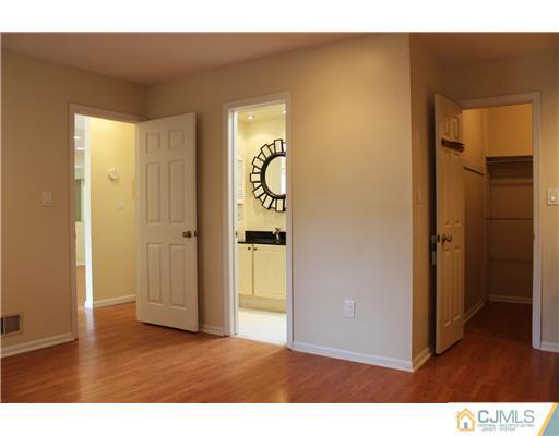 2001 Timber Oaks Road Edison, NJ 08820 - Photo 5 of 25 a view of an empty room with wooden floor